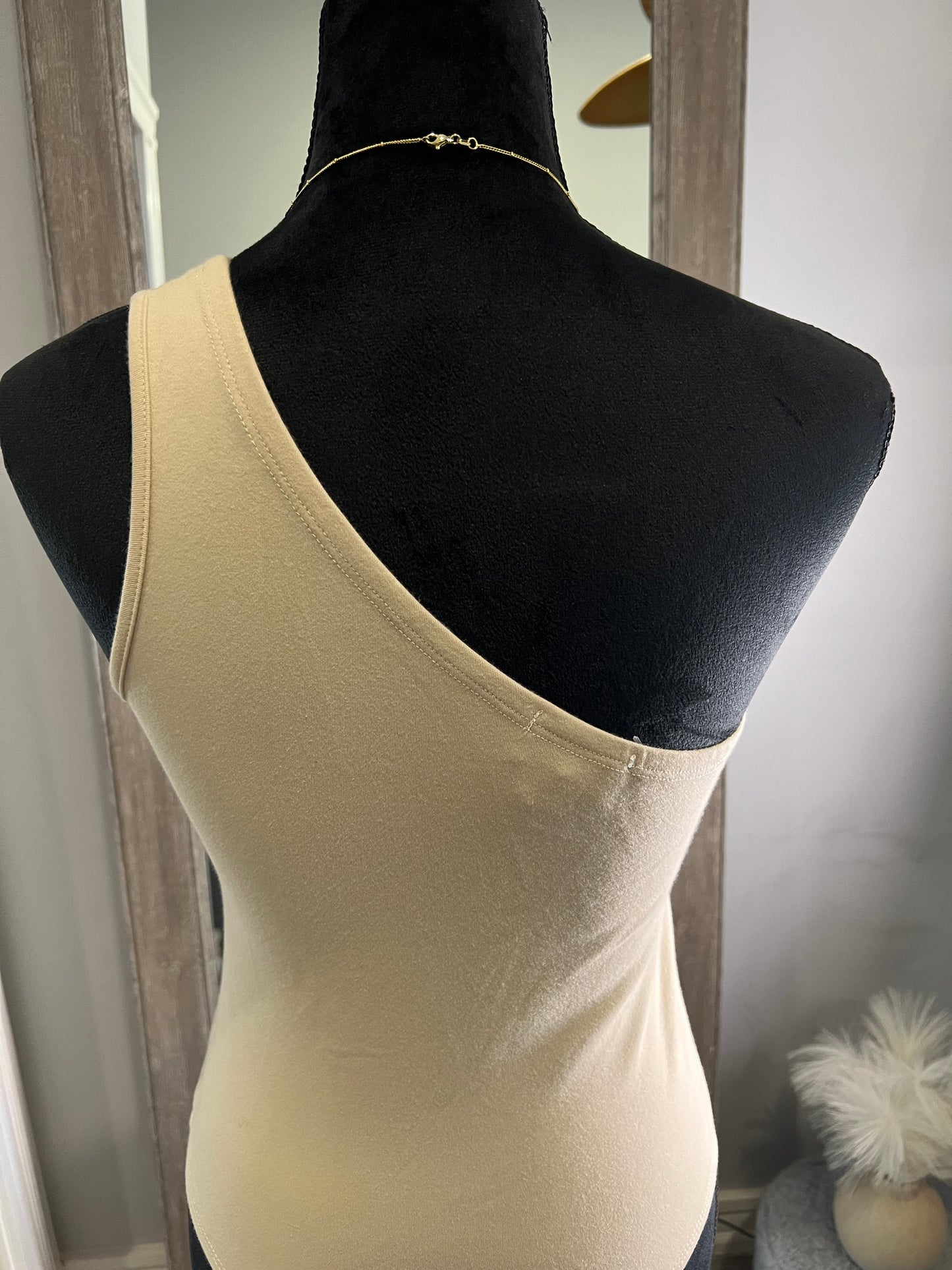 Beige one shoulder bodysuit